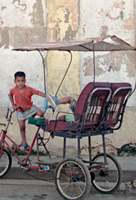 Boys by a Pedicab